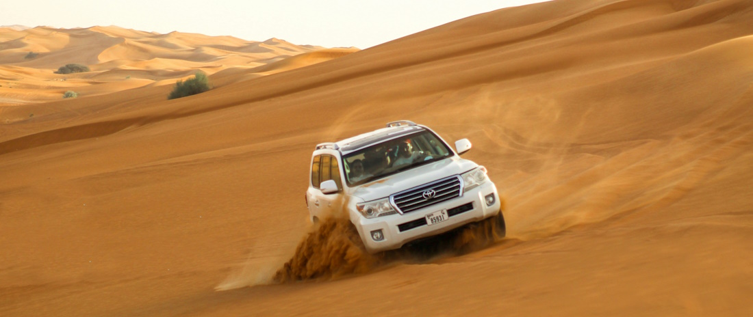 Land Cruiser skidding on dune sand in Dubai