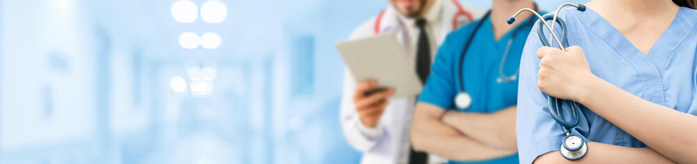 healthcare professionals in a hospital corridor