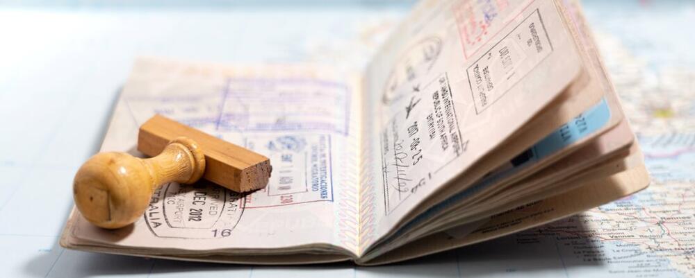Open passport with stamps